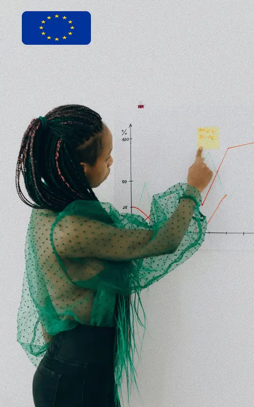 Female researcher analyzing European interim management salary benchmarks and market insights on white board